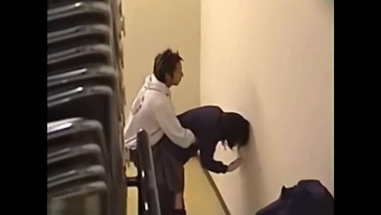 Couples flirting inside of a building